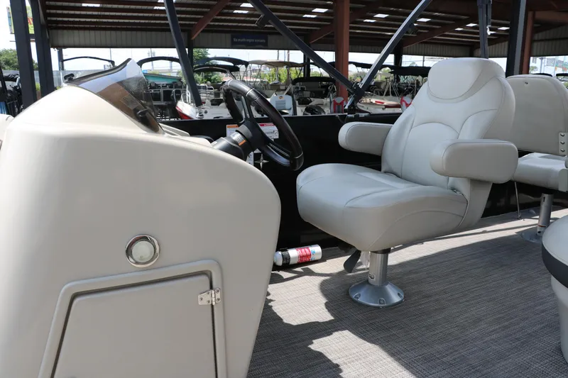 Slide: The Image of 2019 Berkshire 20RFC CTS boat interior with steering wheel and captain's chair. - 35