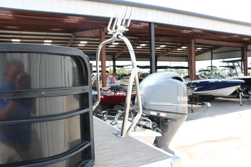 Slide: The Image of 2019 Berkshire 20RFC CTS boat with Yamaha outboard motor in a storage facility. - 9