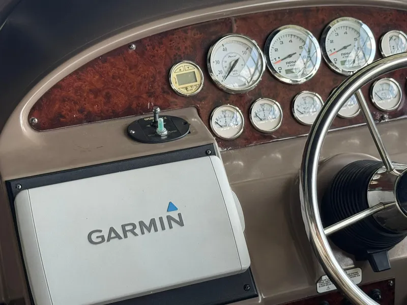 Slide: The Image of Dashboard of a 2006 Regal 3360 Window Express with Garmin navigation system. - 11