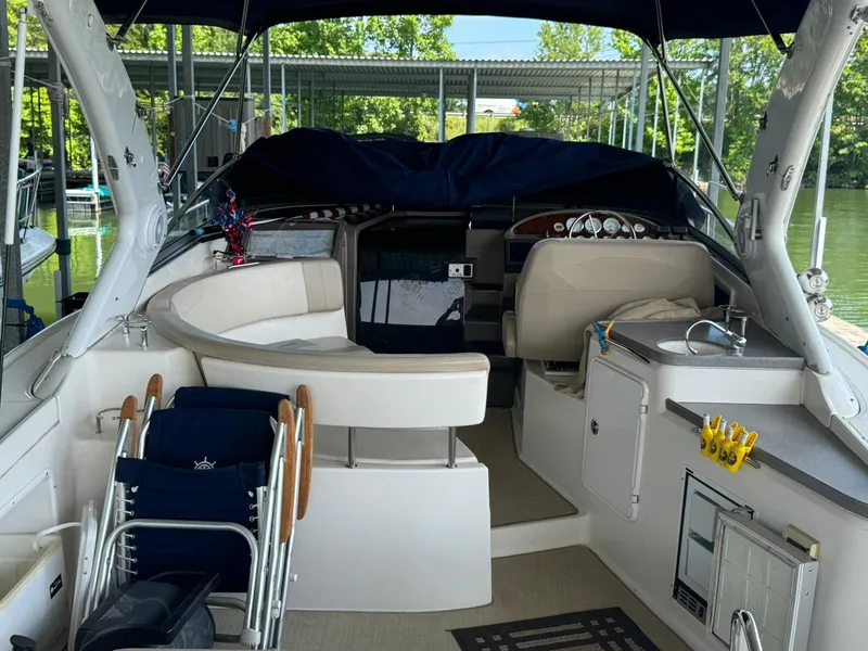 Slide: The Image of 2006 Regal 3360 Window Express boat interior with seating, sink, and helm. - 17