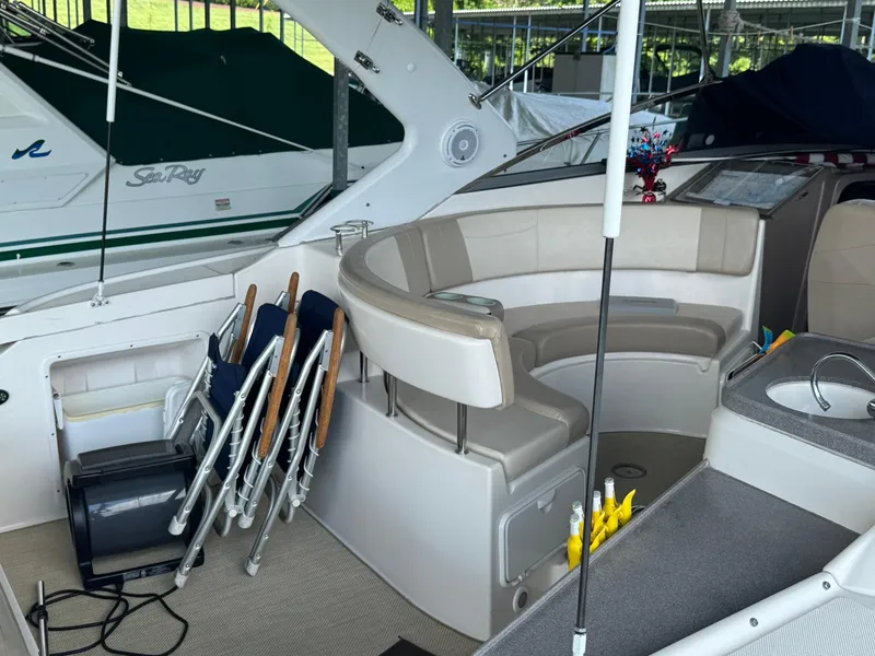 Slide: The Image of 2006 Regal 3360 Window Express boat interior with seating and sink. - 18