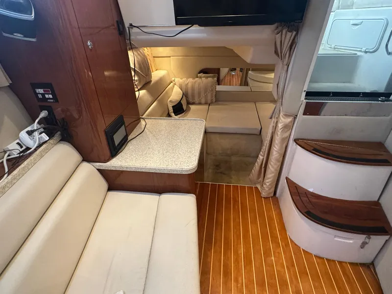 Slide: The Image of Interior of 2006 Regal 3360 Window Express yacht with seating and wooden flooring. - 30