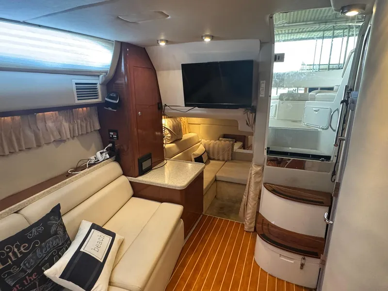 Slide: The Image of Interior of 2006 Regal 3360 Window Express yacht with cozy seating and modern amenities. - 31