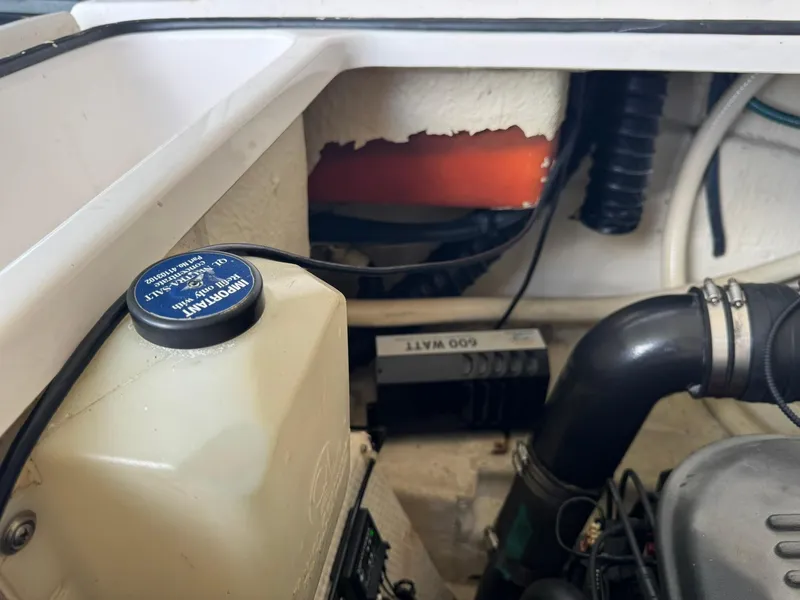 Slide: The Image of Engine compartment of a 2006 Regal 3360 Window Express boat, showing various components. - 43