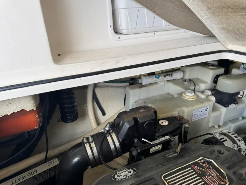 Slide: The Image of Engine compartment of a 2006 Regal 3360 Window Express boat, showcasing mechanical components. - 44