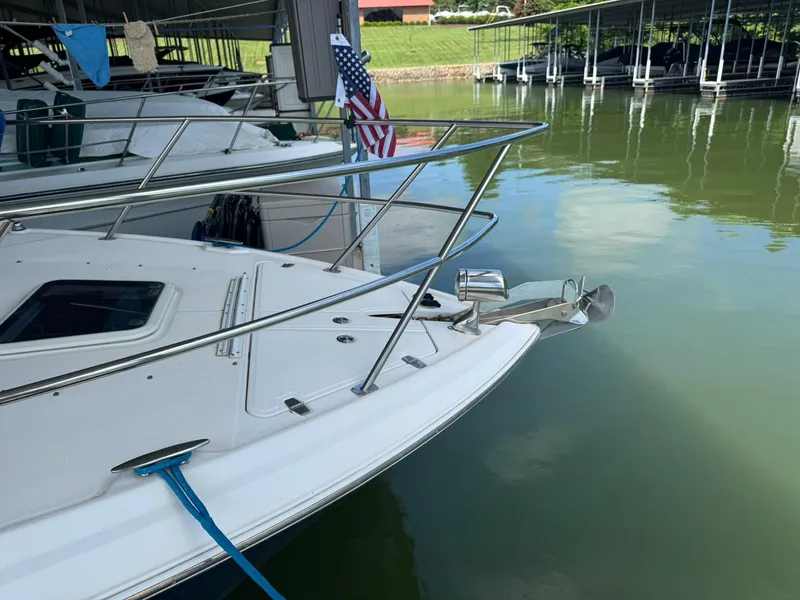 Slide: The Image of 2006 Regal 3360 Window Express yacht docked, featuring sleek design and American flag. - 7