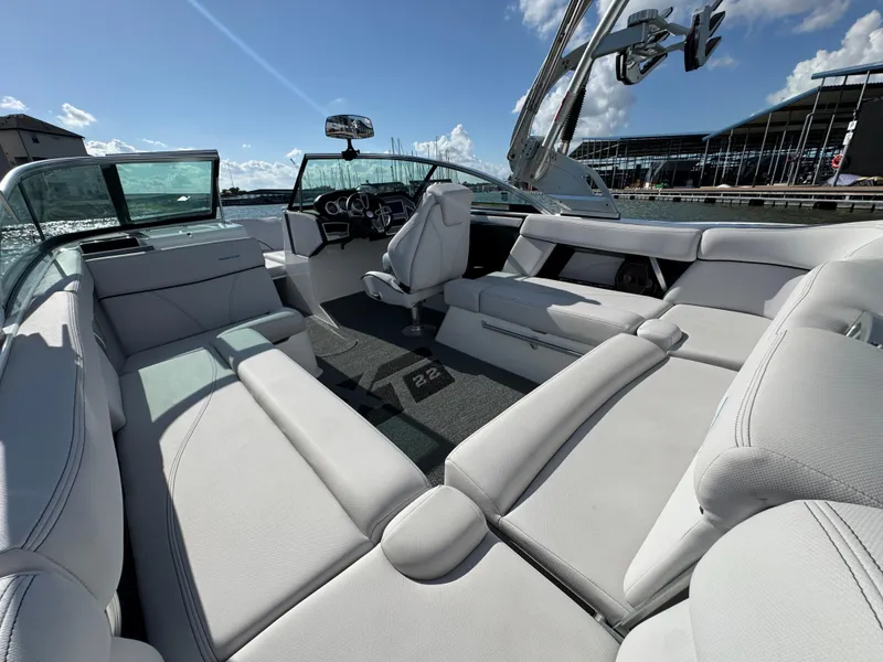 Slide: The Image of 2019 MasterCraft XT22 boat interior with luxurious seating and modern design. - 24