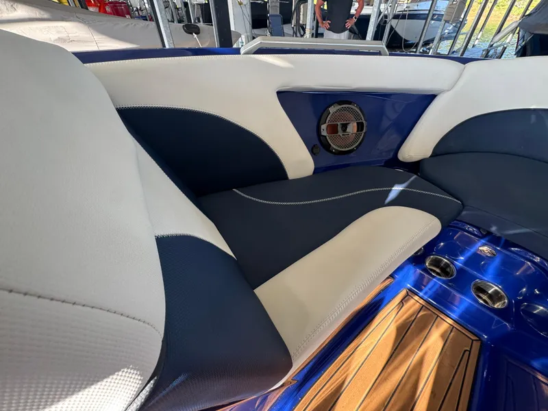 Slide: The Image of Interior of 2021 MasterCraft XT23 boat with blue and white seating and speaker. - 12