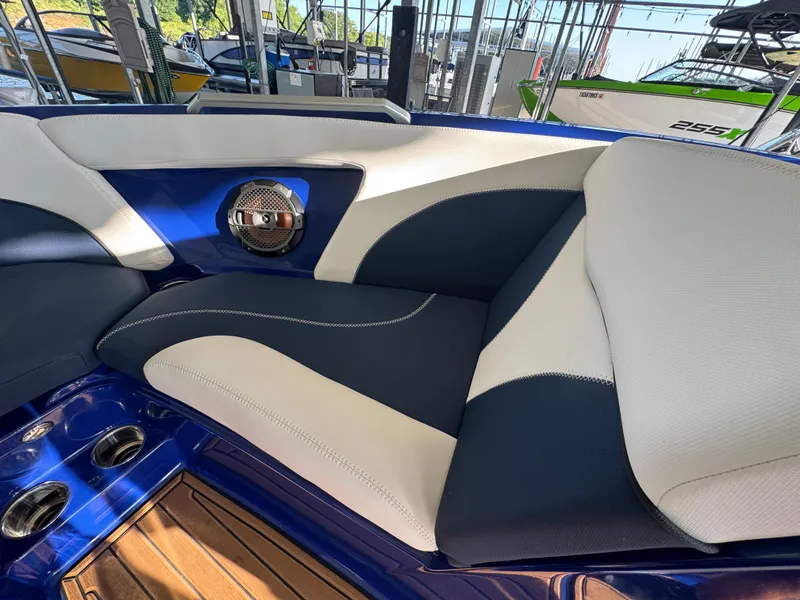 Slide: The Image of Interior of 2021 MasterCraft XT23 boat with blue and white seating. - 13