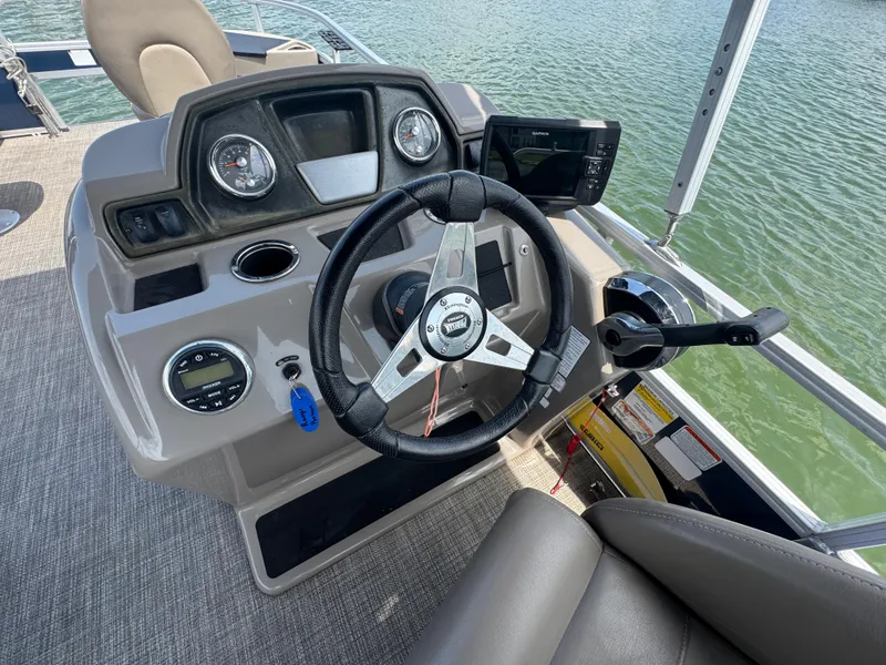 Slide: The Image of Steering console of 2021 Ranger Reata 200F boat with modern controls and navigation system. - 13