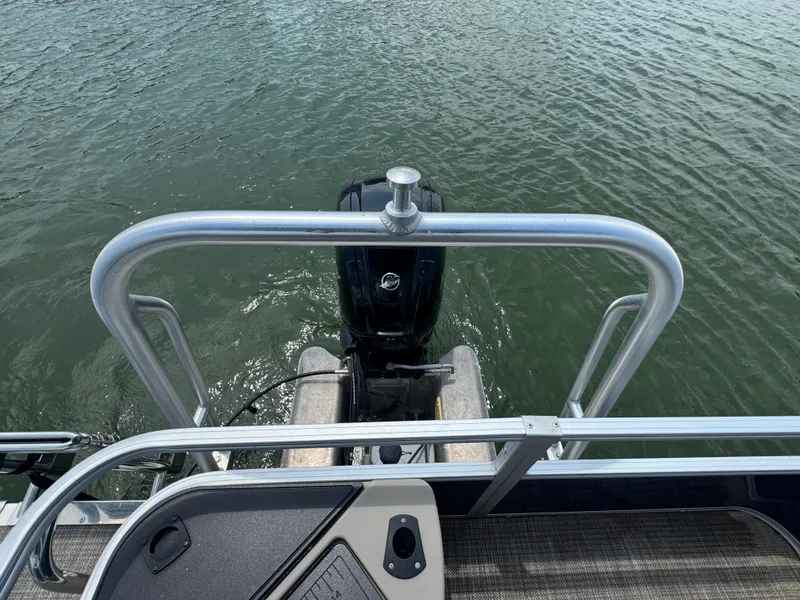 Slide: The Image of 2021 Ranger Reata 200F boat with outboard motor on water. - 19