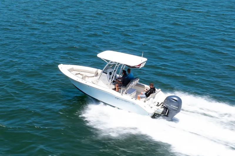 Slide: The Image of 2021 Key West 219 FS boat cruising on open water with passengers. - 12