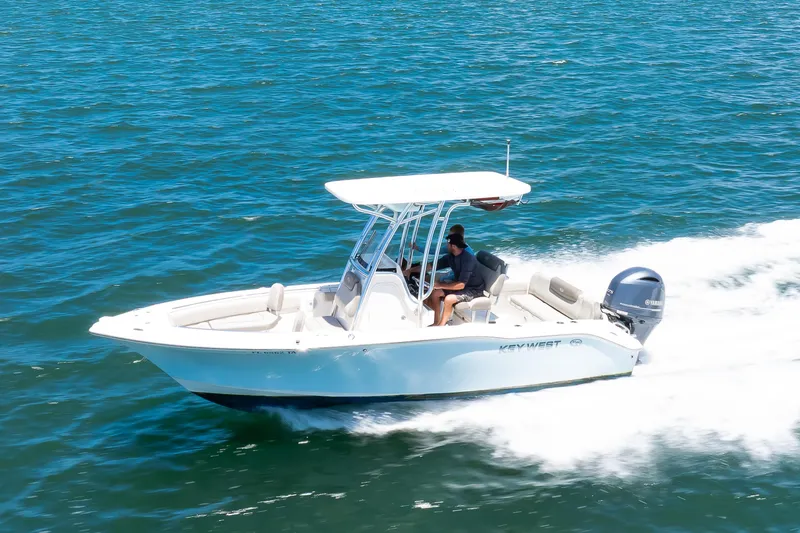 Slide: The Image of 2021 Key West 219 FS boat cruising on open water. - 3
