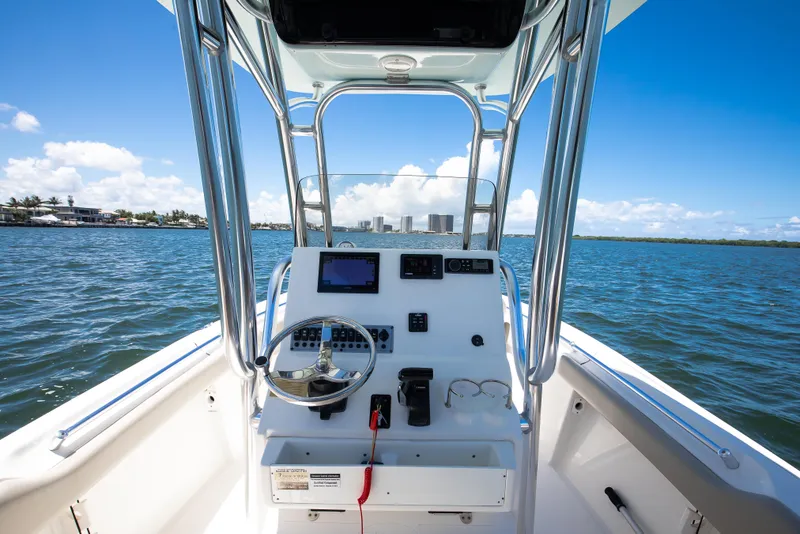 Slide: The Image of 2021 Key West 219 FS boat dashboard on open water, clear blue sky. - 5
