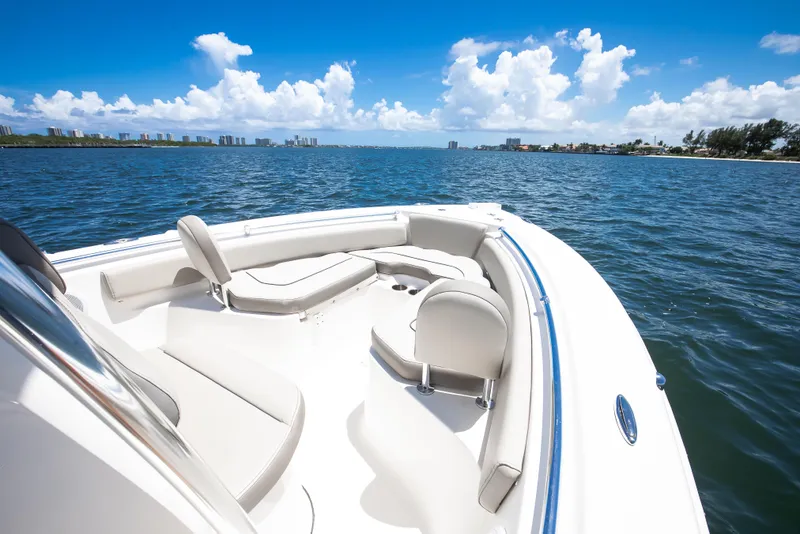 Slide: The Image of 2021 Key West 219 FS boat on open water under clear blue sky. - 8