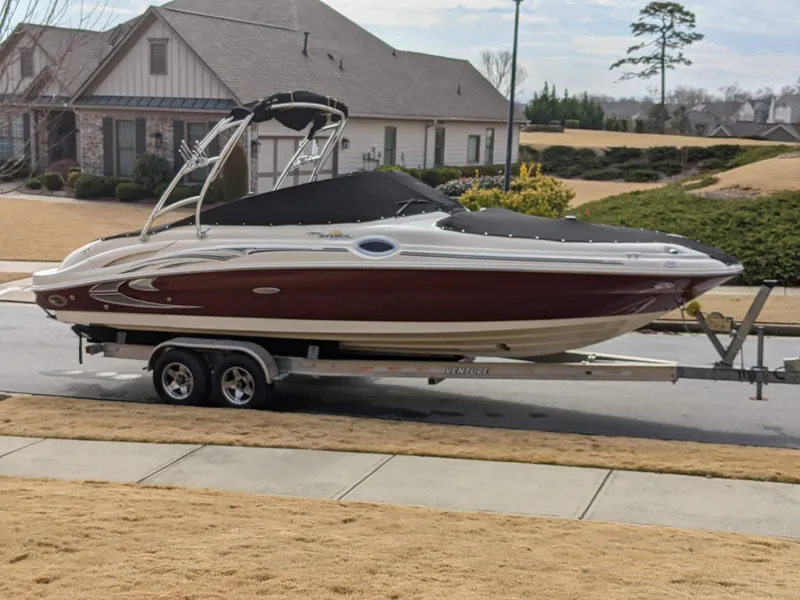 Slide: The Image of 2006 Sea Ray 270 Sundeck boat on trailer in suburban neighborhood. - 23