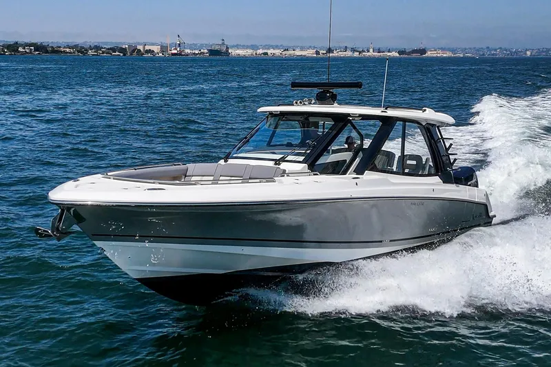 Slide: The Image of 2024 Boston Whaler 380 Realm cruising on open water, showcasing sleek design and performance. - 22