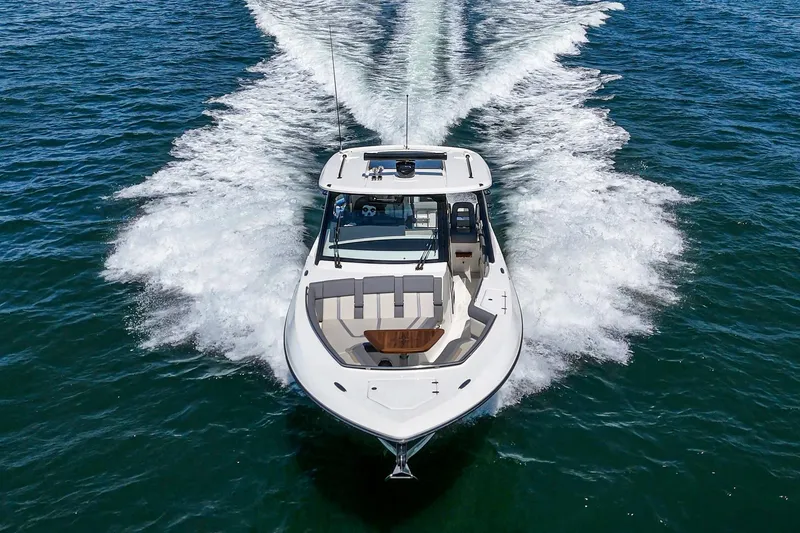 Slide: The Image of 2024 Boston Whaler 380 Realm cruising on open water, showcasing sleek design and powerful performance. - 25