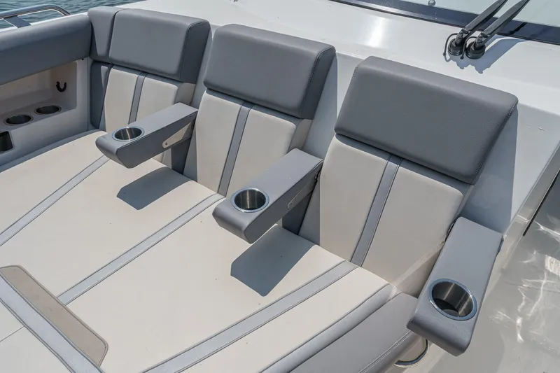Slide: The Image of 2024 Boston Whaler 380 Realm seating with cup holders and armrests. - 28