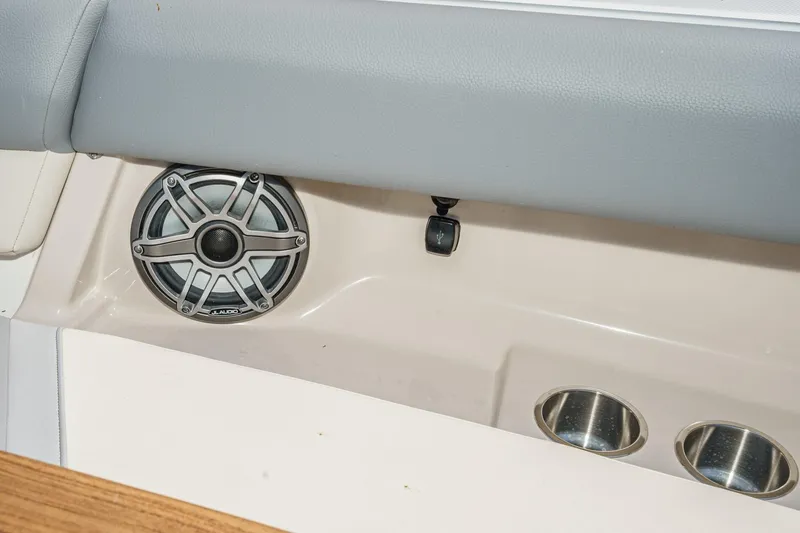 Slide: The Image of 2024 Boston Whaler 380 Realm interior with speaker and cup holders. - 32