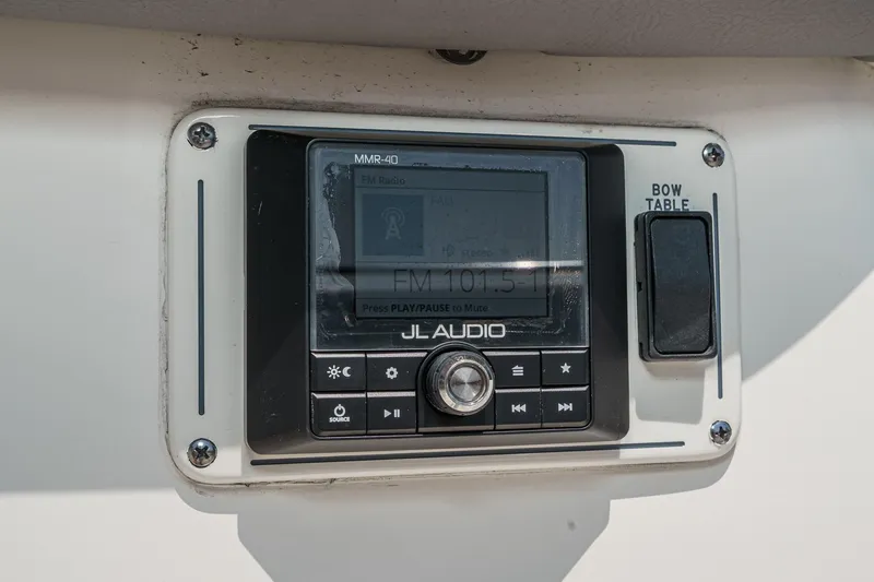 Slide: The Image of JL Audio system on 2024 Boston Whaler 380 Realm boat dashboard. - 33