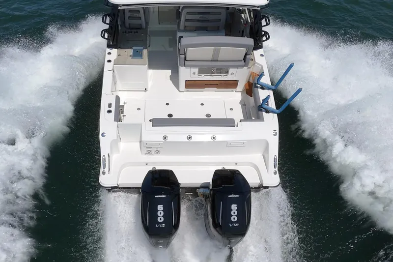 Slide: The Image of 2024 Boston Whaler 380 Realm cruising with dual Mercury 600 V12 engines. - 38