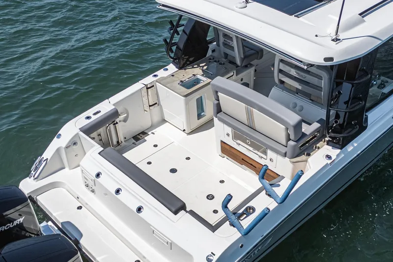 Slide: The Image of 2024 Boston Whaler 380 Realm boat interior, featuring spacious seating and modern amenities. - 40