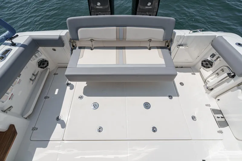 Slide: The Image of 2024 Boston Whaler 380 Realm boat deck with seating and storage compartments. - 43