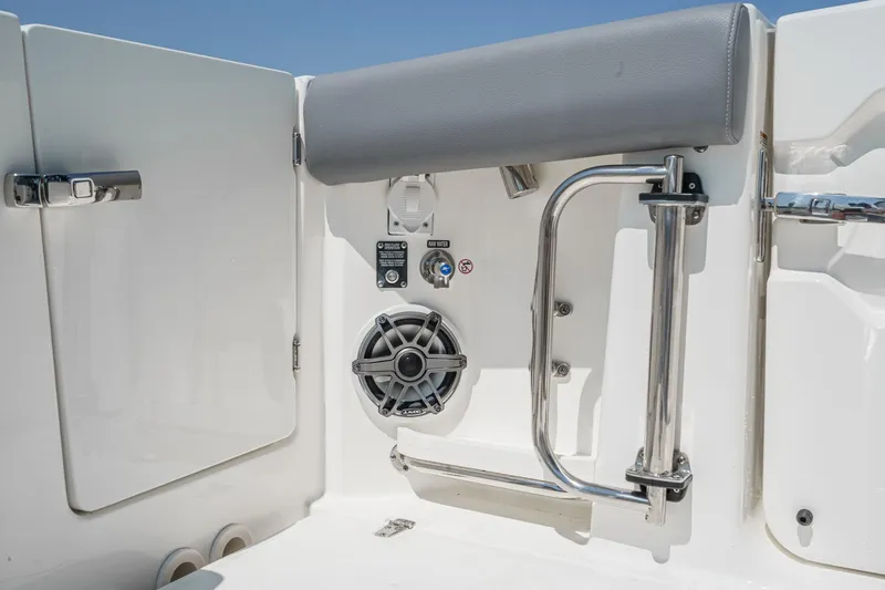 Slide: The Image of 2024 Boston Whaler 380 Realm boat interior with speaker and stainless steel railing. - 46