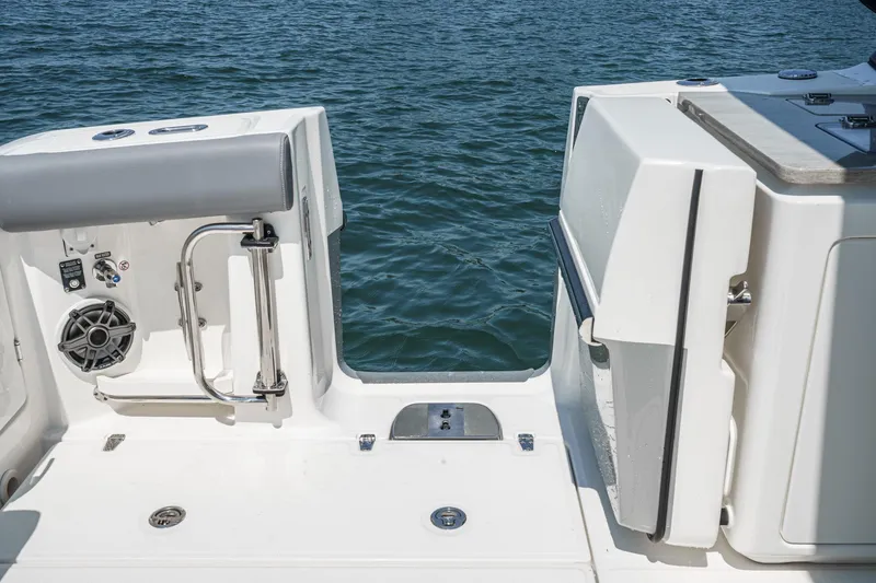 Slide: The Image of 2024 Boston Whaler 380 Realm boat deck with water view and stainless steel features. - 49