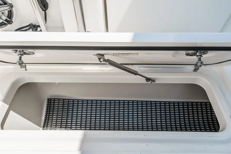 Slide: The Image of Open storage compartment on 2024 Boston Whaler 380 Realm boat. - 50