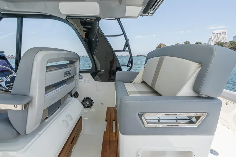Slide: The Image of 2024 Boston Whaler 380 Realm interior with luxurious seating and ocean view. - 64
