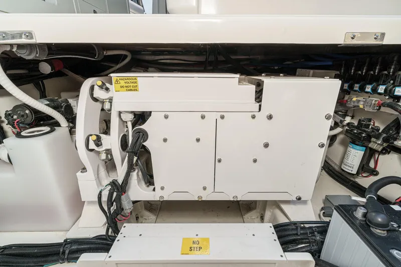 Slide: The Image of Engine compartment of 2024 Boston Whaler 380 Realm, showcasing electrical components and wiring. - 81