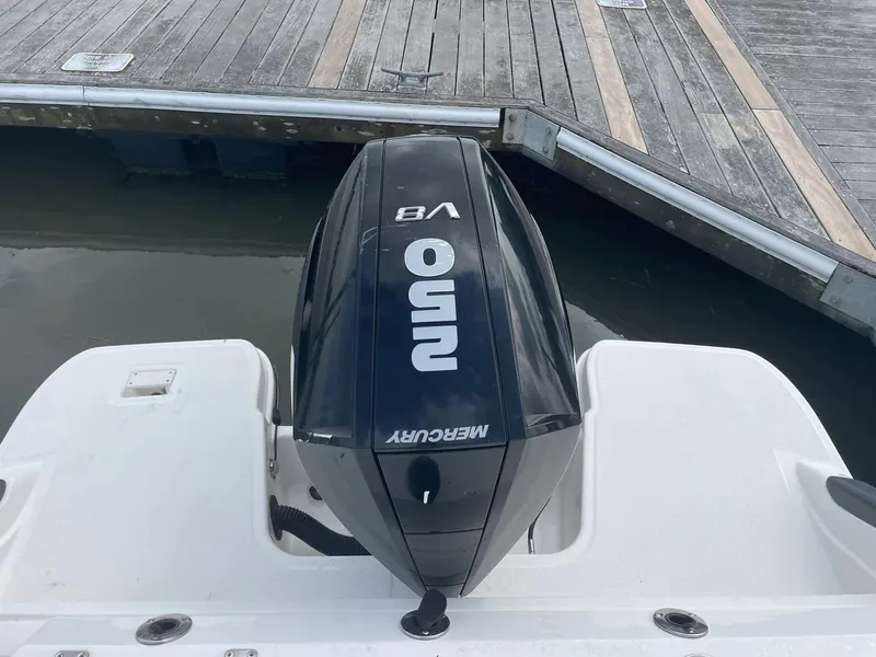 Slide: The Image of 2023 Aquasport 22CC with Mercury V8 outboard engine at dock. - 18