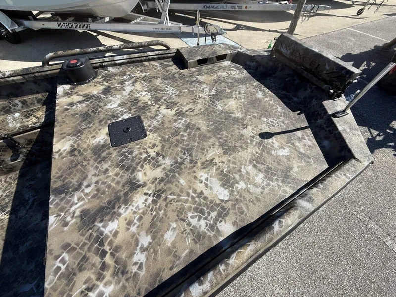 Slide: The Image of 2026 Excel Viper F4 1751 aluminum trailer with camouflage pattern, parked outdoors. - 3