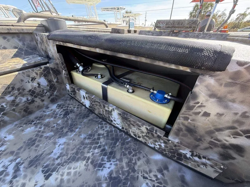Slide: The Image of 2026 Excel Viper F4 1751 aluminum trailer interior with camouflage design and fuel tank. - 4