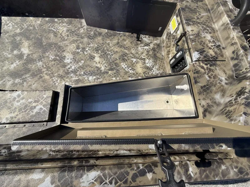 Slide: The Image of 2026 Excel Viper F4 1751 aluminum trailer interior with camouflage pattern and storage compartment. - 7