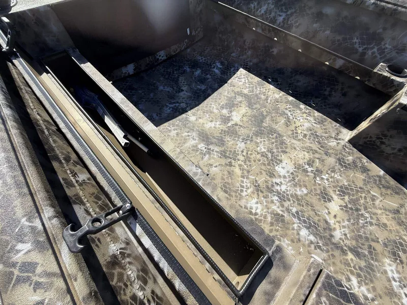 Slide: The Image of 2026 Excel Viper F4 1751 aluminum trailer interior with camouflage pattern and storage compartment. - 8