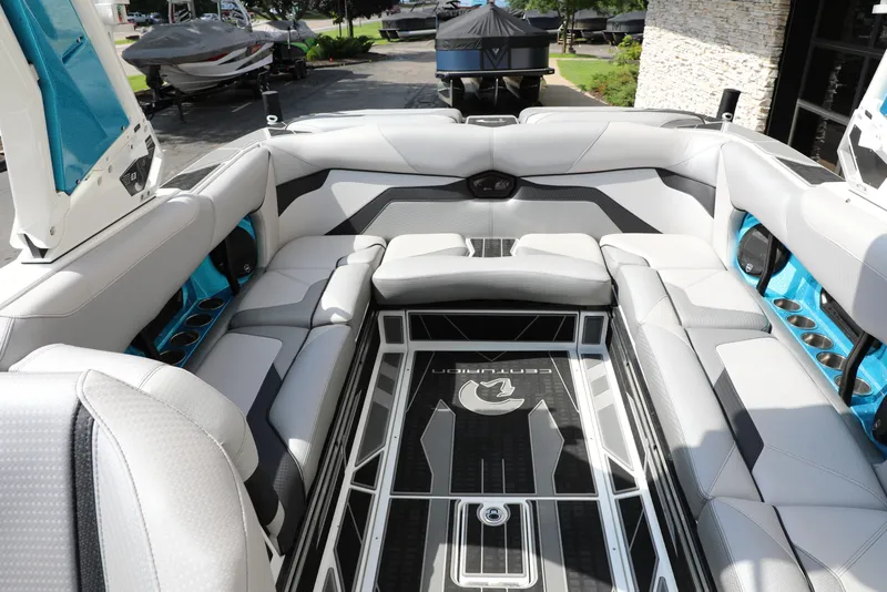 Slide: The Image of 2021 Centurion Ri245 boat interior with luxurious seating and modern design. - 10