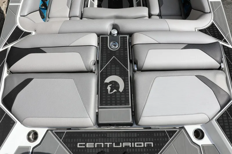 Slide: The Image of 2021 Centurion Ri245 boat interior with sleek gray seating and modern design. - 11
