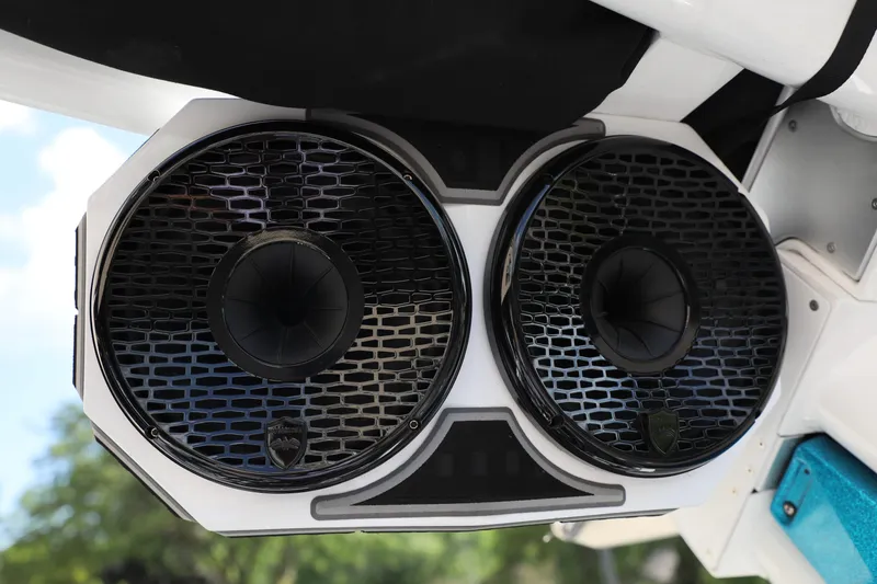 Slide: The Image of 2021 Centurion Ri245 boat speakers, black grille, mounted under white canopy. - 12