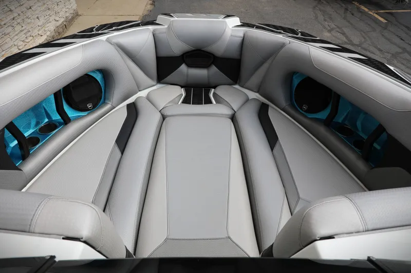 Slide: The Image of Luxurious interior of 2021 Centurion Ri245 boat with sleek gray seating and blue accents. - 4
