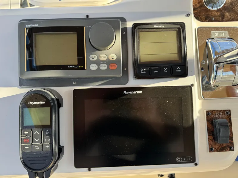 Slide: The Image of Control panel of a 1998 Sea Ray 420 Aft Cabin with Raymarine navigation equipment. - 13