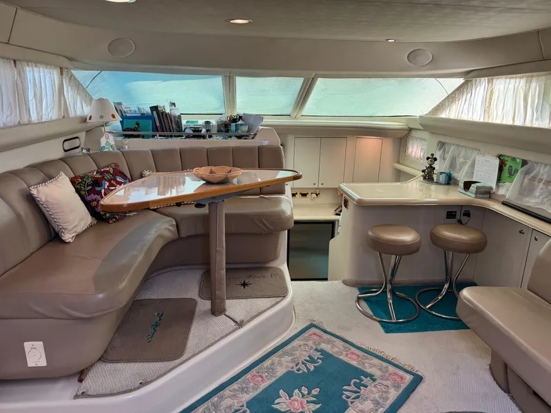 Slide: The Image of Luxurious interior of a 1998 Sea Ray 420 Aft Cabin yacht with plush seating and elegant decor. - 17