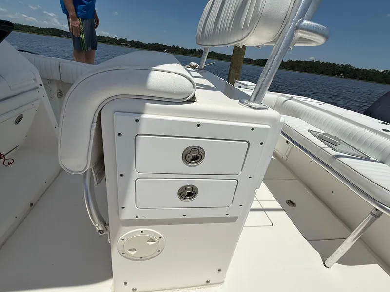 Slide: The Image of 2006 Regulator 26 Forward Seating boat interior with storage compartments and seating. - 22