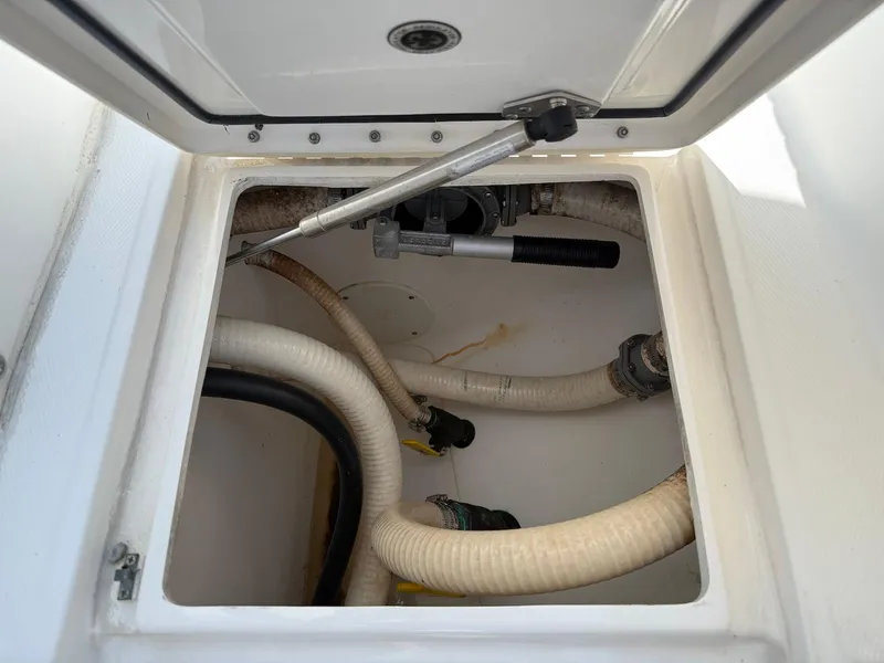 Slide: The Image of 2006 Regulator 26 Forward Seating boat compartment with hoses and fittings. - 31