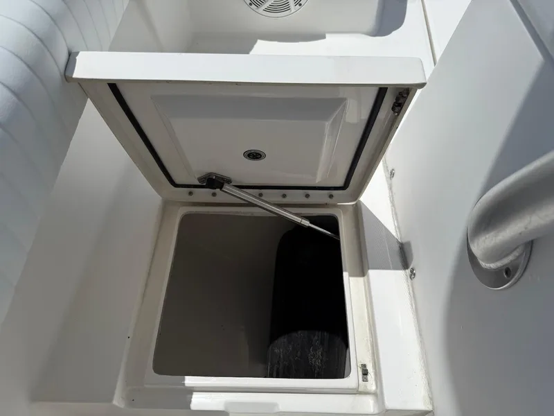 Slide: The Image of Open storage compartment on 2006 Regulator 26 Forward Seating boat. - 32
