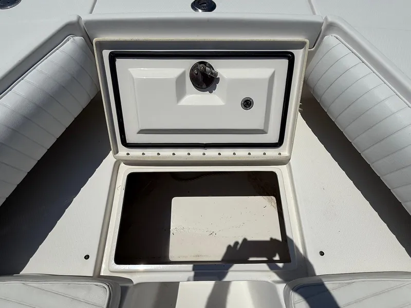 Slide: The Image of Open storage compartment on a 2006 Regulator 26 Forward Seating boat. - 37