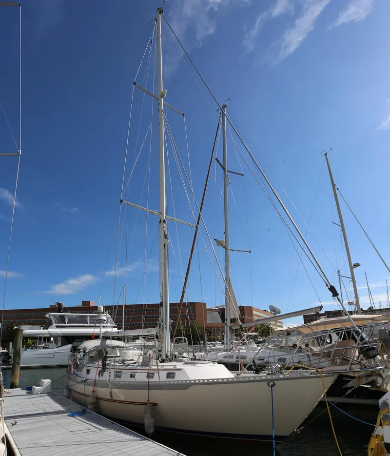 Slide: The Image of 2004 Pacific Seacraft Crealock 40 sailboat docked at marina under clear blue sky. - 19