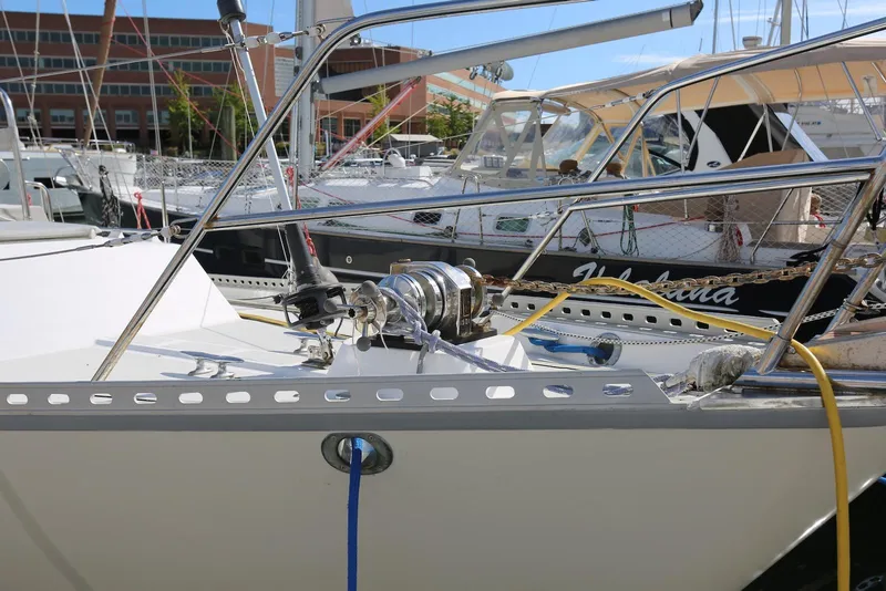 Slide: The Image of 2004 Pacific Seacraft Crealock 40 sailboat docked in marina, featuring deck and rigging. - 21